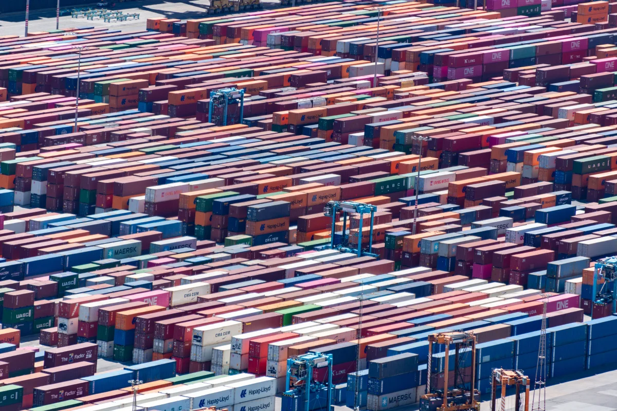 Shipping containers and port machinery seen from above